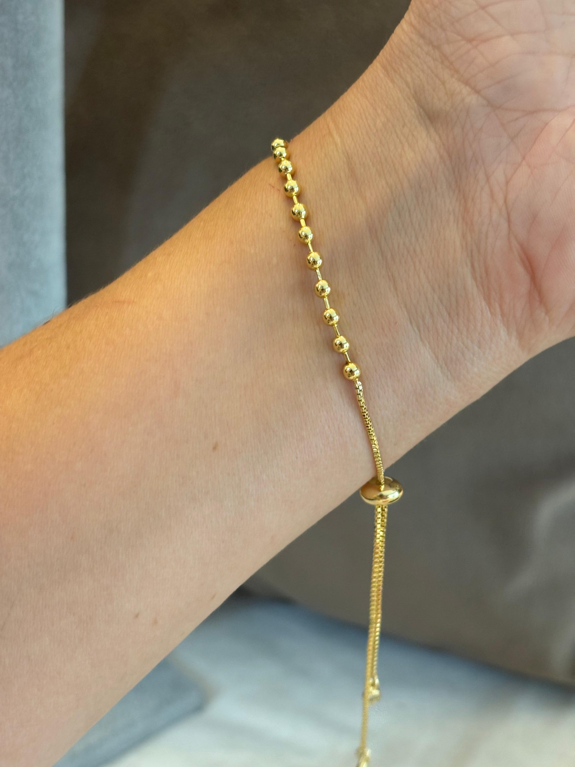 Pulsera bolitas chapa de oro 18k